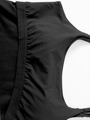 Black built-in bustier crop camisole with ruched detail and adjustable strap.