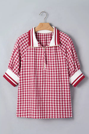 Red gingham cotton blend shirt with puff sleeves, zip collar, and striped cuffs.
