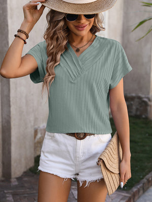 Sage green textured V-neck tee with short sleeves and subtle vertical ribbing.