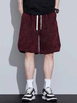 Burgundy textured drawstring shorts with a relaxed fit and white drawstrings.