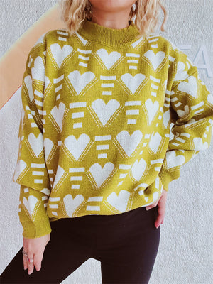 Mustard geometric heart jacquard knit jumper with mock neck and long sleeves.