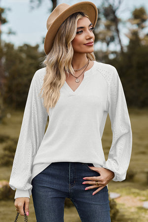 White waffle knit raglan V-neck top with eyelet detail on sleeves.