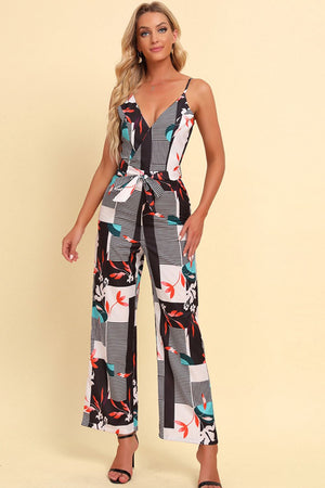 Geometric print cami jumpsuit with tie waist and wide legs.