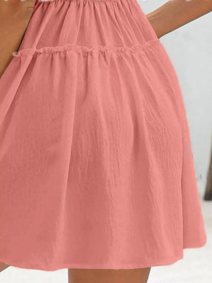 Apricot frill tiered mini dress with ruffled tiers and a gathered waist.