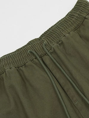 Olive green cargo pants with elastic waistband and adjustable drawstring