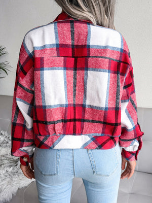 Oversized red, white, and blue plaid shacket with buttoned cuffs and elastic hem.
