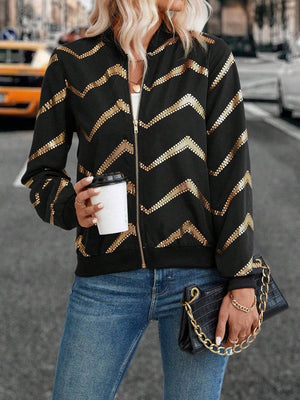 Black bomber jacket with gold chevron sequin pattern and zip front.