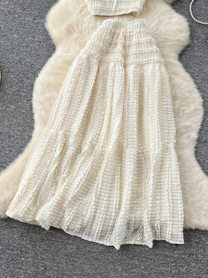 White ruched polyester crop top and maxi skirt set with frill details.