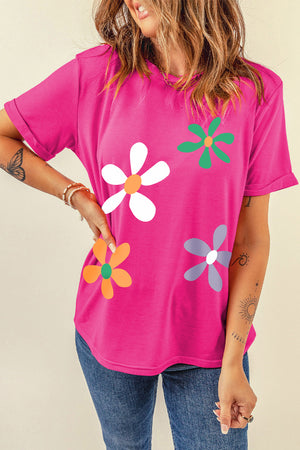Hot pink t-shirt with a casual fit and a colorful daisy graphic print.