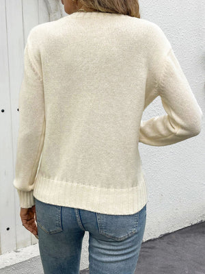 Cream crewneck knit sweater with lace inset detail and ribbed cuffs and hem.