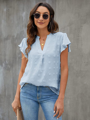 Light blue textured voile blouse with flutter sleeves and a V-neck.