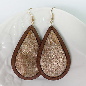 Leopard print teardrop wood earrings with gold accents and faux fur texture.