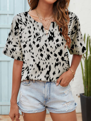 Dalmatian print relaxed notch neck blouse with short sleeves.