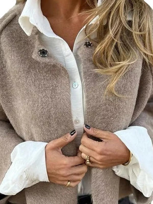Cozy fuzzy knit cardigan in Khaki with button detail and white shirt.