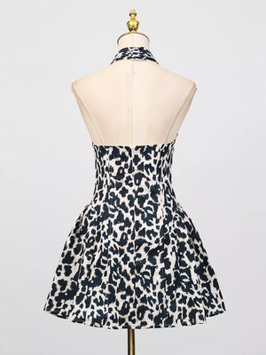 Halter neck leopard print mini dress with a flared skirt in black and white.