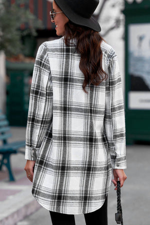 Oversized plaid shirt jacket tunic in black and white, with buttoned cuffs and a curved hem.