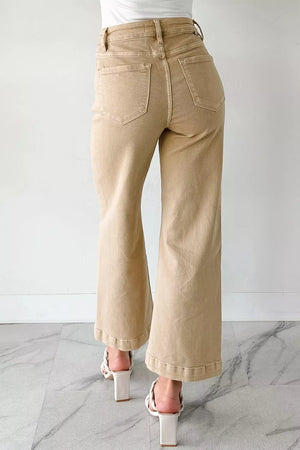 High-waisted cropped wide-leg jeans in tan denim with frayed hem detail.
