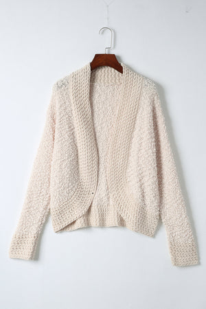 Textured bouclé open-front jacket in cream, with a relaxed fit and long sleeves.
