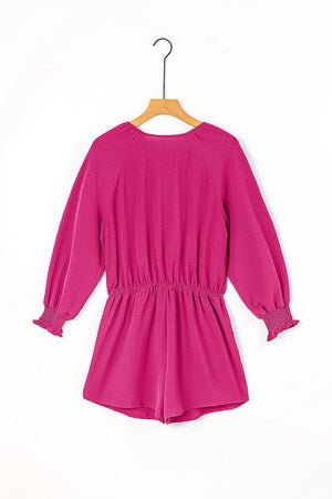 Cerise tie-front blouson sleeve playsuit with elastic waist and smocked cuffs.