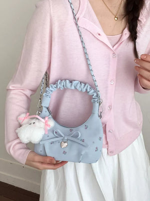 Blue ruched mini crossbody bag with floral print, bow charm and heart lock