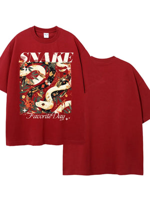 Red oversized tee with a bold snake and floral graphic print and "Favorite Day" text.