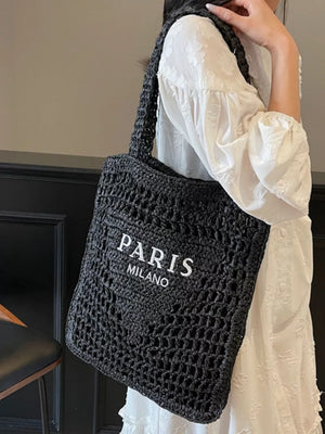 Black crochet tote bag with white PARIS MILANO text detail.