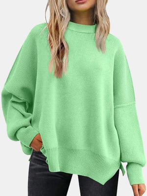 Mint green ribbed knit sweater with slouchy sleeves and mock neck.