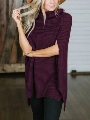 Deep Purple cape sleeve turtleneck knit sweater with ribbed texture and split sides.