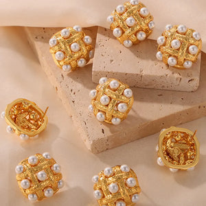 Gold woven pearl grid stud earrings with textured metal detail.