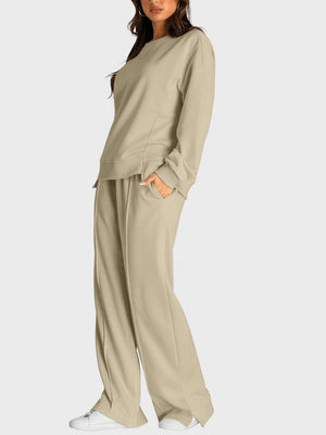 Tan loungewear set with crewneck sweatshirt and slit-front wide-leg trousers.