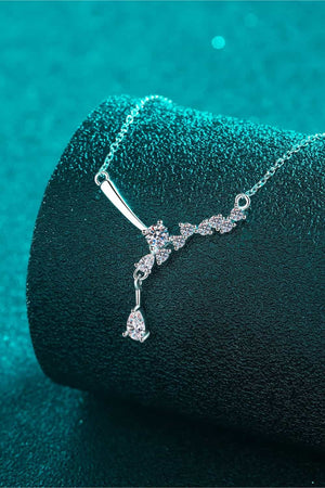 Silver asymmetrical moissanite cluster pendant necklace with a teardrop accent.