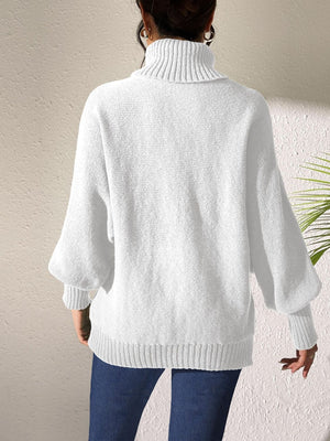 White knit turtleneck sweater with balloon sleeves and ribbed cuffs and hem.