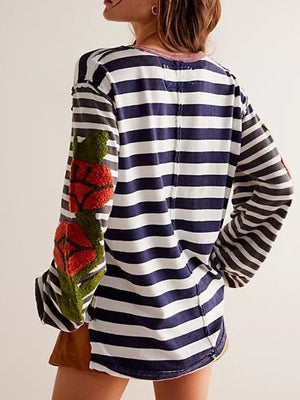 Long sleeve tee with navy and white stripes and embroidered floral detail on sleeve