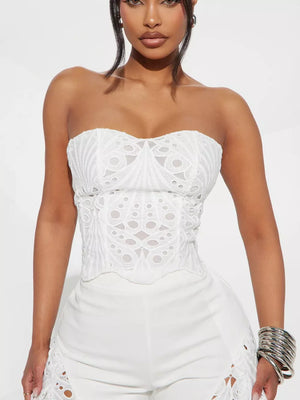 White lace cutout tube top and wide-leg pants set with eyelet details.