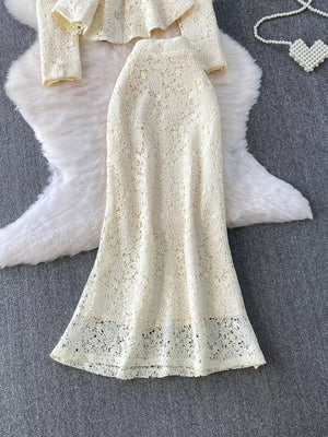 Cream lace peplum top and midi skirt set with ornate floral pattern and scalloped hem.