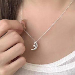 Sterling silver crescent moon and star charm necklace with adjustable chain