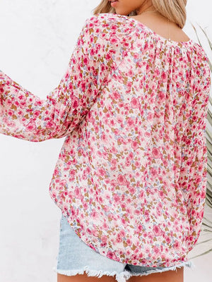 Maternity floral print long sleeve shirt with V-neck and gathered detail in pink.