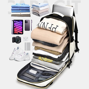 Black and beige travel backpack with contrast panels, packed with clothes, laptop, tablet, phone, camera, and shoes.