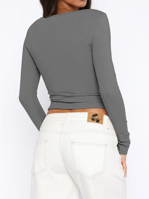 Gray ribbed button-down crop top with long sleeves.