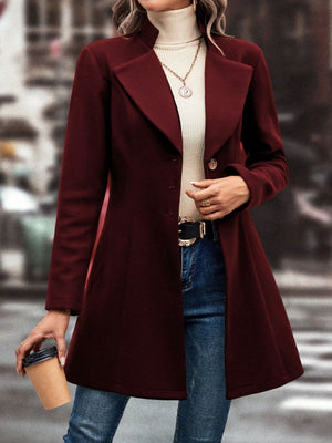 Burgundy wool coat with flared hemline, button closure, and notched lapels.