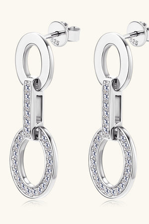 Silver geometric pavé drop earrings with oval links and sparkling stones.