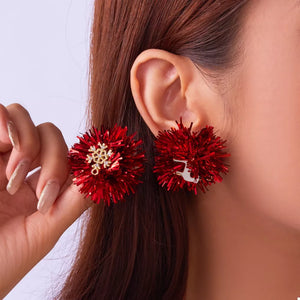 Red tinsel ball statement earrings with snowflake and reindeer charms, 18k gold.