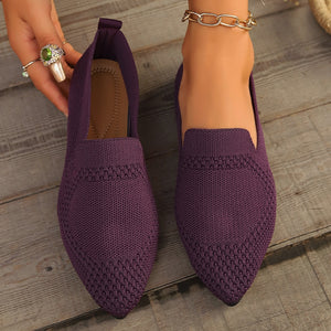 Purple pointed-toe knit flats with a breathable design.