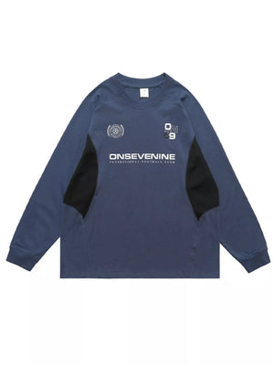 Relaxed fit royal blue long-sleeve tee with black paneling and graphic print.