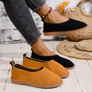 Classic round toe comfort flats in black and yellow with espadrille soles.