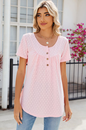 Blush pink eyelet yoke gathered henley shirt with short sleeves and button detail.
