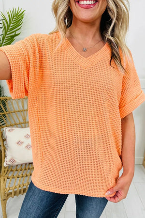 Sherbet waffle knit v-neck t-shirt with cuffed short sleeves.