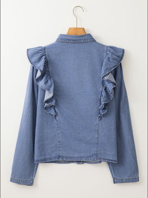 Denim ruffle yoke shirt in medium wash cotton with long sleeves and a collared neckline.