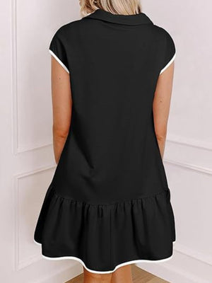 Black cap sleeve ruffle dress with white trim, above knee length.