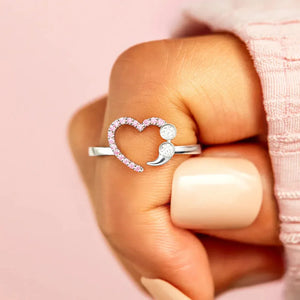 Sterling silver ring with heart and semicolon design with pink stones